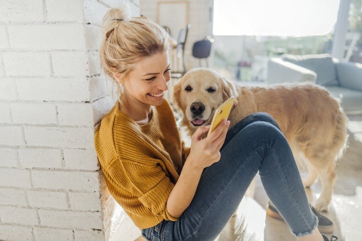 Lady with dog on phone